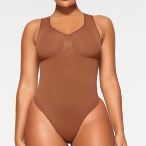 Skims Seamless Sculpt Scoop Neck Thong Bodysuit in Bronze